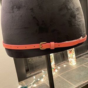 Pink buckled belt